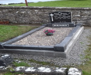 Old black headstone with mid grey base, kerb and 4 posts